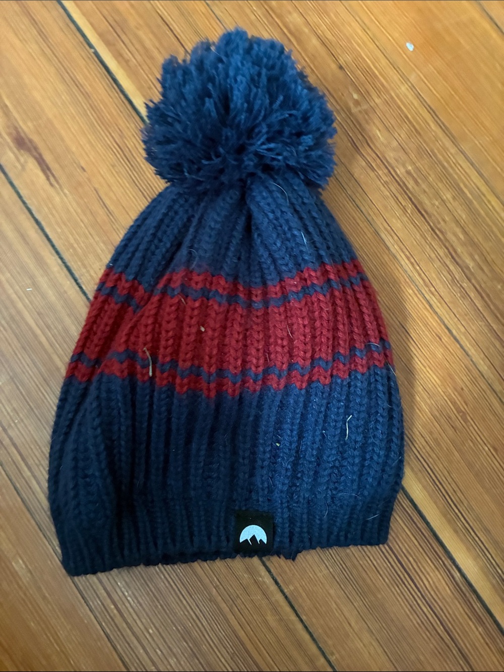 Blue hat with red stripe
